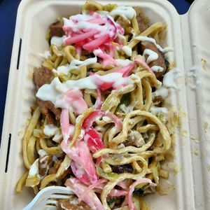 Sicilian Lo Mein special with housemade "pork", pickled onions, cabbage, and delicious sauces.  at Guud & Evul in Tonawanda