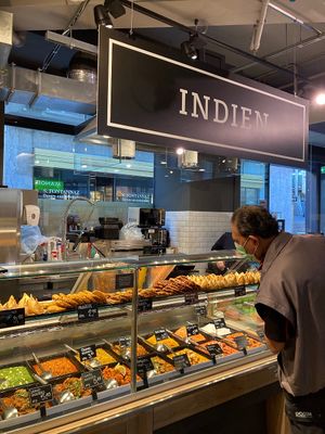 Indian prepared food station at MANOR in Lausanne