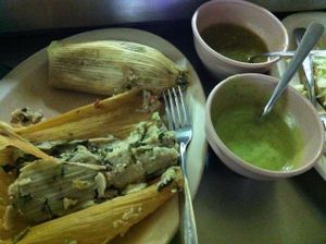 vegetarian tamales (sin Manteca) with spinach, mushroom and cheese. served with rather watery but tasty guacamole and salsa. at Trigo Verde in Oaxaca
