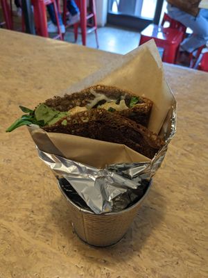 I got the vegan grilled cheese and added mushrooms and spinach. It was delicious. Definitely gooey. Totally worth it. Wish I had enough room for a sweet crepe.  at Crepes Paulette in Bentonville