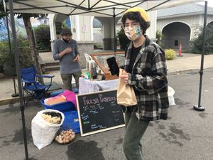Happy vegan camper with an apple croissant   at Hatsikana Farmstand in Cottage Grove