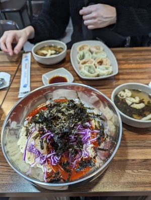 Bibim guksu and mandu in background at Daom Noodle 다옴국수 in Seoul
