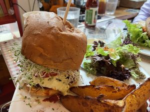 “I am Fabulous” burger, served with wedges and side salad    at Veggie4Love in Hong Kong Island