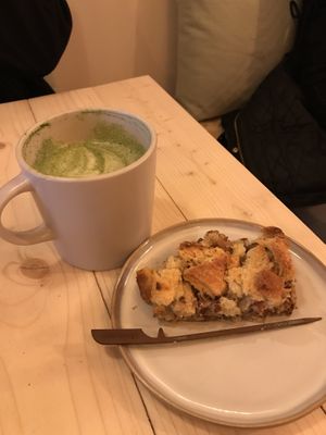 An oat Matcha latte with the lovely croissant cake  at Taylor's Cafe in Brussels