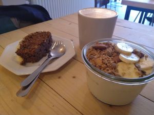 Soy yogurt with granola, carrot cake and speculatte at Taylor's Cafe in Brussels