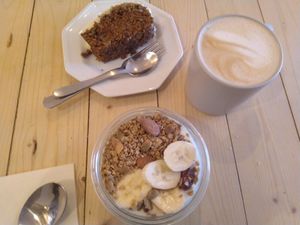 Soy yogurt with granola, carrot cake and speculatte at Taylor's Cafe in Brussels