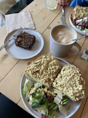 Vegan snickers, toast with tofu “egg”, cafe latte with almond milk  at Taylor's Cafe in Brussels