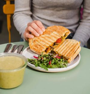 Our lunch toastie is made with red pesto, tofu, seasonal veggies, cherry tomatoes and vegan cheese  at Taylor's Cafe in Brussels