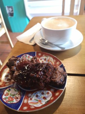 Chocolate cherry gluten free vegan cake and huge oat flat white at Riverside Cafe in Newcastle Emlyn