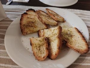 Appetizer for free : Toasted White Bread with Olive Oil and Herbs at Melitzia Taverna in Tala