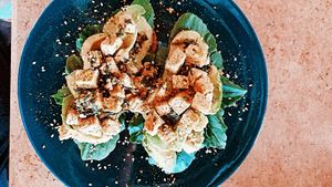 “Vegan avocado toast” with homemade vegan pesto sauce, fresh rocket leaves and avocado slices, lightly fried tofu & spinach mix, sesame seeds at The Breakfast Cafe in Dahab