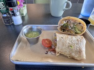 The Burrito Guapo can still be ordered vegan by request.  The updated menu removed mentioning this.  It is one of my staples.  at Mi Vida in Tybee Island