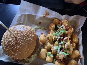 Smash burger with loaded tots  at Green Kitchen in Cleveland