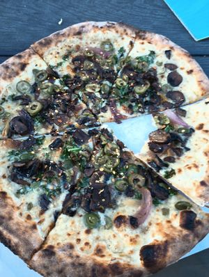 Vegan mushrooms with green olives at Pizza Creature in Portland