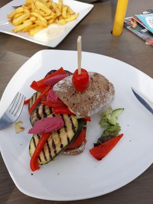 Sandwich with cold grilled veggies, beetroot hummus and avocado creme at De Strandtent in Callantsoog