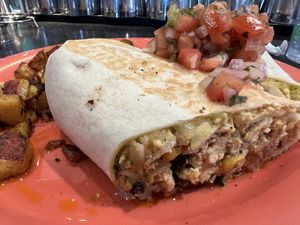 Tofu Burrito with home fries and fresh salsa 🤤😍  at The Friendly Toast in Danvers