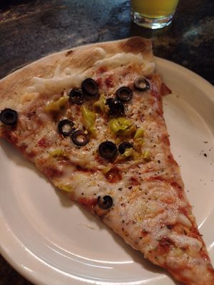 Black olives and pepperoncinis with vegan cheese. at North Fork Brewery in Deming