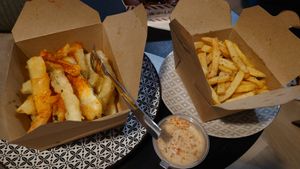 Zucchini fries and common french fries with tahini sauce at EATERY in Athens