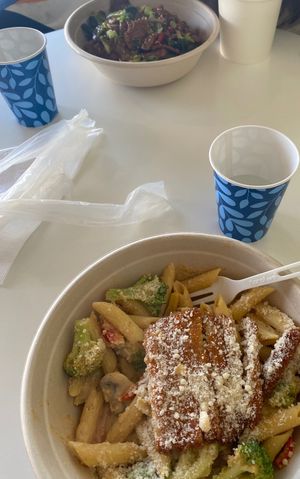 Pepper steak bowl (top) and Cajun chicken pasta (bottom-cashew sunflower cream sauce with Cajun seasoning, vegan chicken tenders, broccoli, mushrooms, bell peppers, vegan parmesan) at Loving Hut in Reynoldsburg