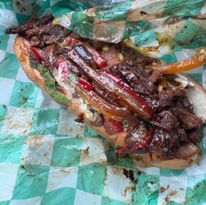 Grilled steak sandwich (marinated textured vegetable protein, onion, bell peppers, mushroom, cheese, mayo, lettuce, and tomato on hoagie bread) at Loving Hut in Reynoldsburg