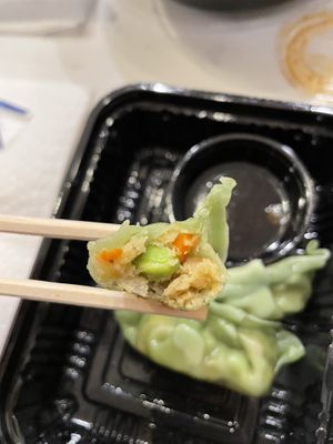 Veggie gyoza cross section - love that dipping sauce   at Hakata Ramen & Sushi in Wayne