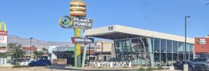 10th location, 1st outside of California, on the morning of its opening day, October 15, 2021. Looks like a changing of the guard with its notorious predecessor in the background. at Plant Power Fast Food - Craig Rd in Las Vegas