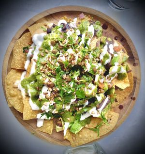 “I am SHARING “
NACHOS !
black beans, cashew nacho cheese, pico de gallo, avocado, spicy pepitas .so beautifully delicious.   at Cafe Gratitude- Larchmont in Hollywood