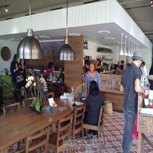 Interior, communal table at Cafe Gratitude- Larchmont in Hollywood