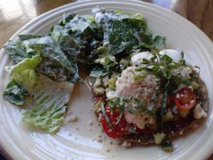 raw pizza and Caesar salad at Cafe Gratitude- Larchmont in Hollywood