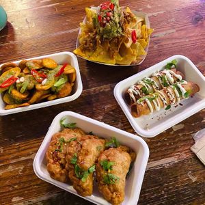 Clockwise from top: chipotle jackfruit nachos, spinach & feta taquitos, jalapeño & cheese empanadas, spicy potatoes & salsa verde at Antojitos - The Dog House in Edinburgh