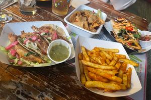 From left to right: banana blossom tacos, nachos, spicy fries and seitan quesadillas   at Antojitos - The Dog House in Edinburgh