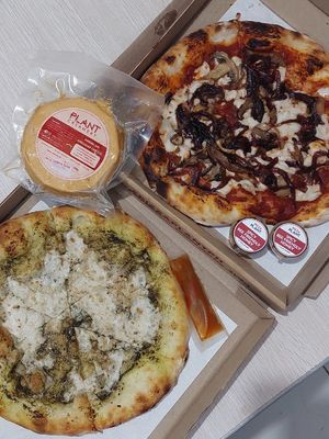 Pizza Bianca and Wild Mushroom Pizza. Also ordered cheddar cheese block & extra spicy bee-friendly honey at Pizza Plant in San Juan