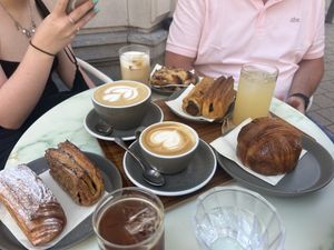 Cream and cinnamon croissants, pecan bun, iced long black, sausage roll & lattes  at WAY Specialty Coffee Roasters - Voldersstraat in Ghent