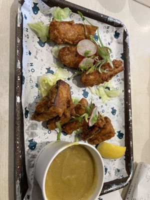 Three battered sausages and tofish bites (with more curry sauce)   at The No Catch Co in Brighton