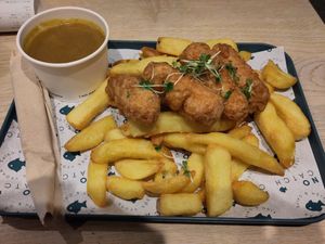 Large sausages and chips with curry sauce at The No Catch Co in Brighton