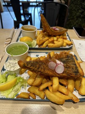 Large portion of “Cod” & chips with mushy peas😍 the curry sauce is unreal too!  at The No Catch Co in Brighton