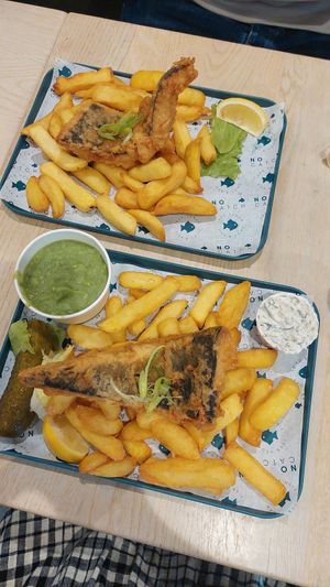 Large vegan cod and chips, bottom pictured with mushy peas, tartare sauce and gherkin at The No Catch Co in Brighton