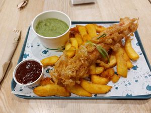 Jumbo battered saveloy, chips, bbq sauce and mushy peas at The No Catch Co in Brighton