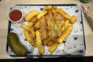 battered sausages, chips and gherkin  at The No Catch Co in Brighton