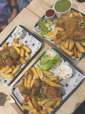 Cod and chips, haddock and chips and battered sausage and chips, with mushy peas and homemade tartare sauce.   at The No Catch Co in Brighton