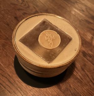 White Russian with SIC chocolate coin at Speak In Code in Manchester