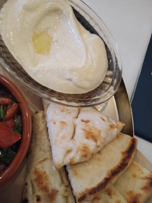 hummus and pita, part of the breakfast plate at Tel Aviv Urban Food in Warsaw