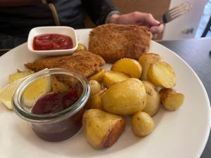 Schnitzel with roasted potatoes and gooseberry jam  at Dada in Regensburg