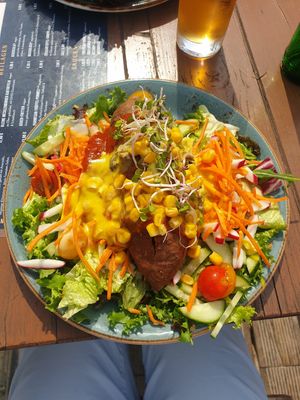 Colourful sweet potato kumpir with vegan cheese sauce at JOHO Broiler in Prerow