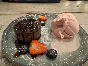 Vegan chocolate cheesecake with vegan strawberry ice cream. Delicious    at Hooked  in Sligo