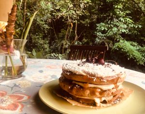 Gluten-free Vegan coconut cake with layers of monk sugar Carmel with coconut cream and cherries :) at Waterfall Villas in Dominical