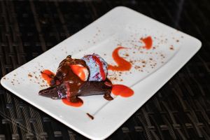 Gluten free raw dehydrated organic Chocolate crepe with blue spirulina vegan ice scream with strawberry sauce  at Waterfall Villas in Dominical
