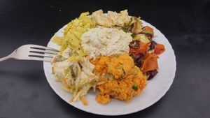 live food week plate - yellow soy curd, marinated tofu, veg stir fry, carrot salad, coleslaw, garlic tofu spread at The Miznon in Dimona