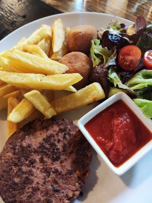 Vegan kids menu with burger at Biltegia in Navarra