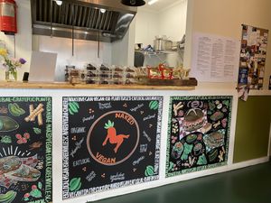 Cute art, and a selection of cakes.  at Naked Vegan in Greenville